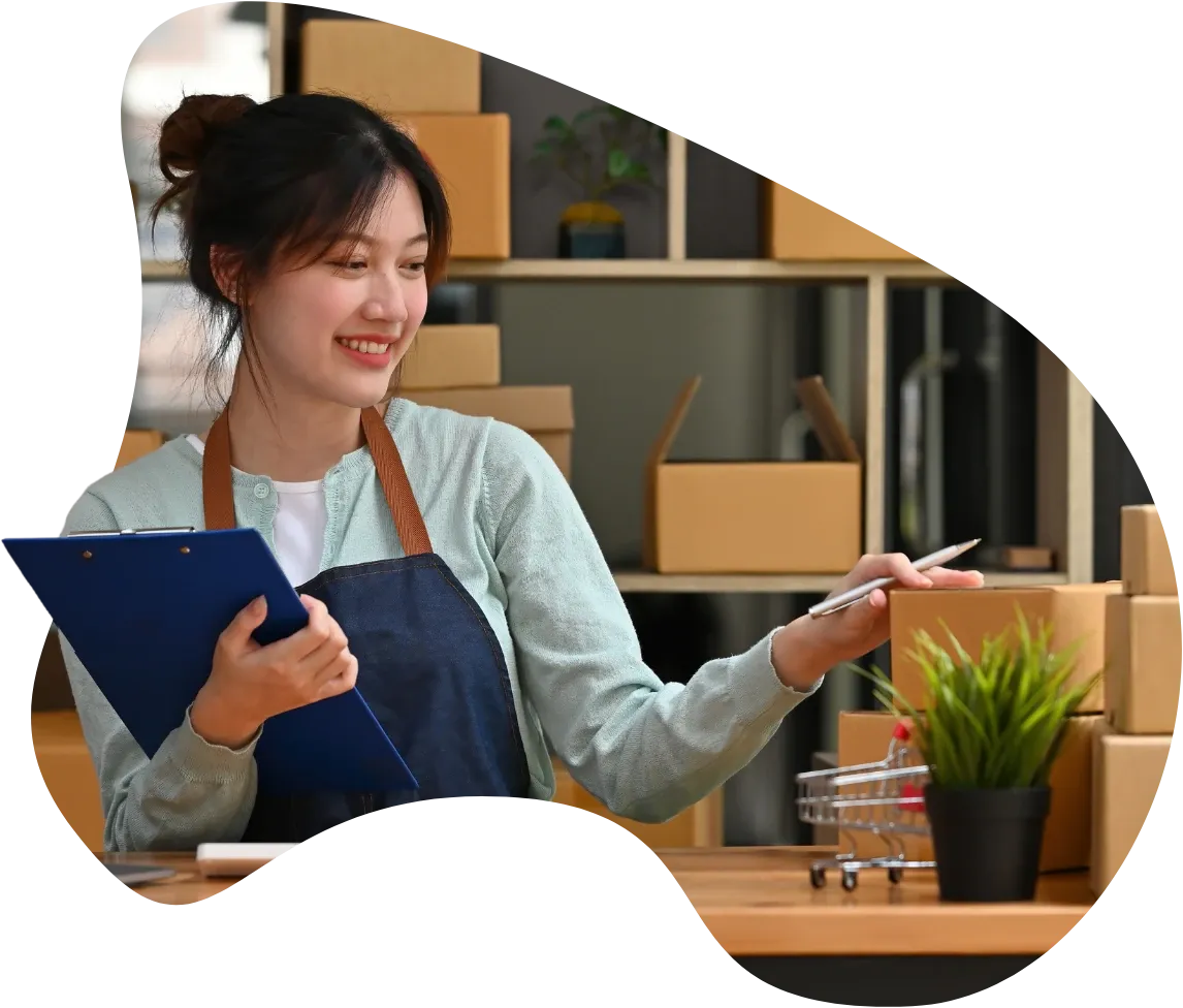 Small business owner reviewing paperwork in her shop