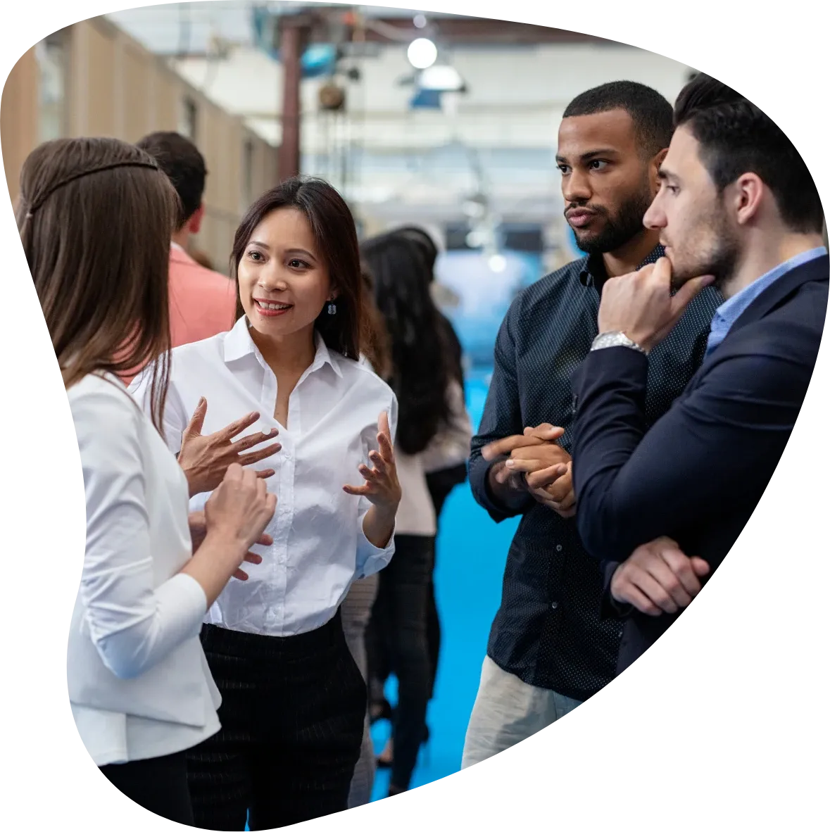Professionals talking together at a community event