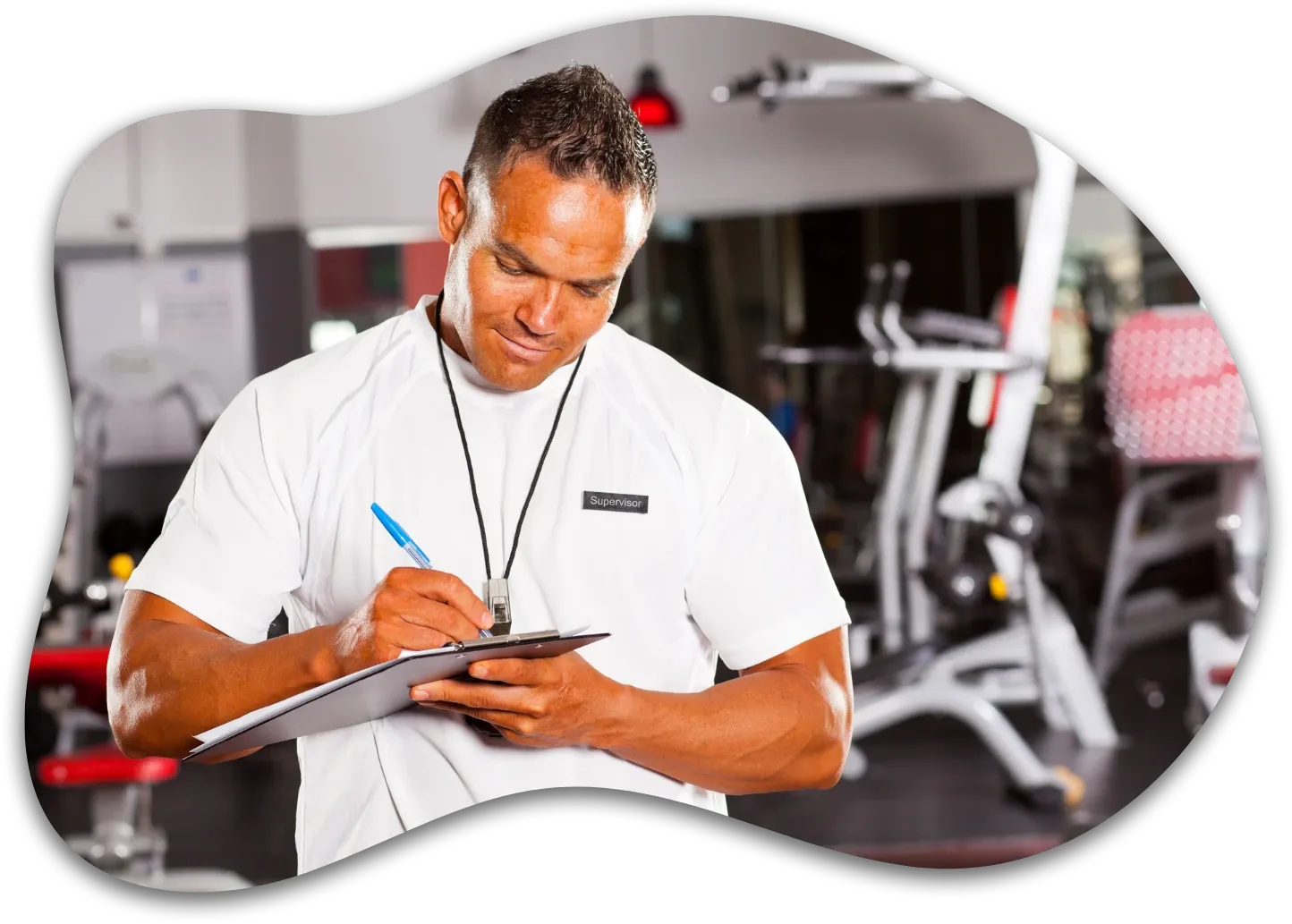 Fitness instructor reviewing a clipboard